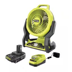 A yellow and black fan with batteries on top of it