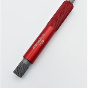 A red and black screwdriver on top of white surface.