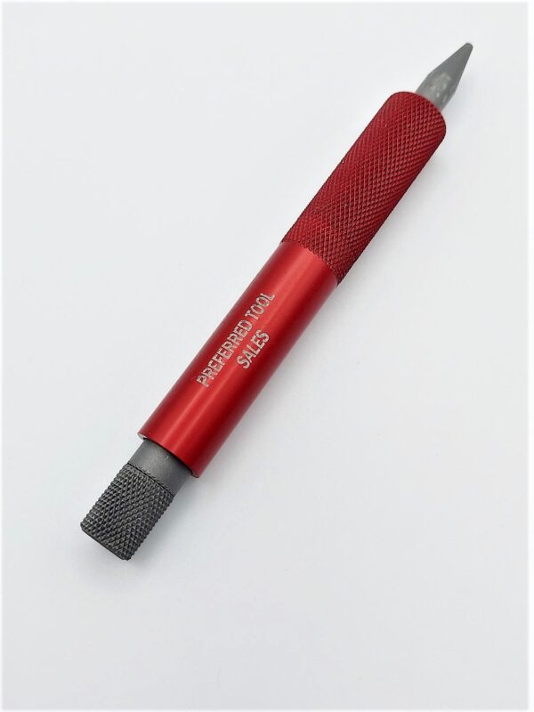 A red and black screwdriver on top of white surface.