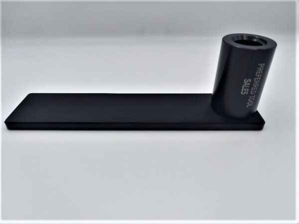 A black plastic tube sitting on top of a table.